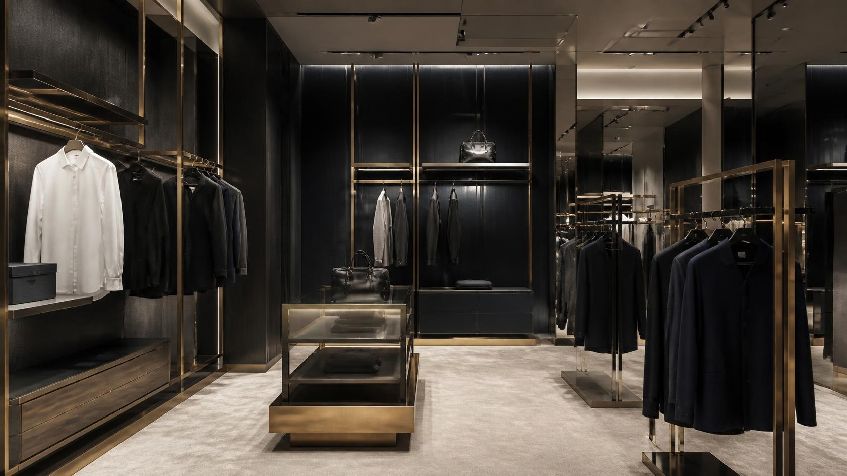 Luxury menswear boutique with gold PVD display fixtures